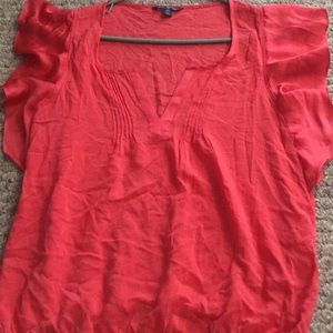 Coral, light weight shirt with ruffle sleeves.